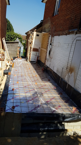 Double storey side extension with pitched roof and raised driveway Project image