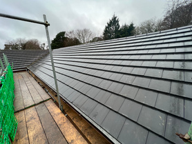 Interlocking tile roof installation. Solar panel installation.  Project image