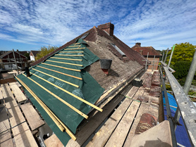 Tiled roof installation. Chimney removal.  Project image