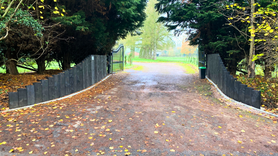 Timber sleeper retaining entrance wall  Project image