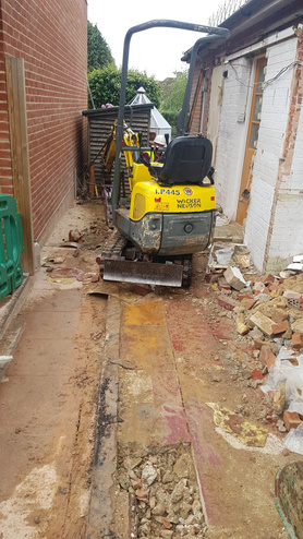 Double storey side extension with pitched roof and raised driveway Project image
