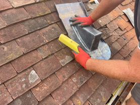 Tiled roof installation. Chimney removal.  Project image