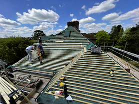Tiled roof installation. Chimney removal.  Project image