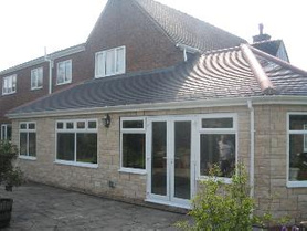 enlargement of sunroom/conservatory. Before and after. Project image