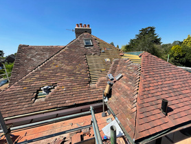 Tiled roof installation. Chimney removal.  Project image