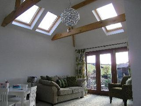 single storey extension with hipped roof and exposed beams Project image