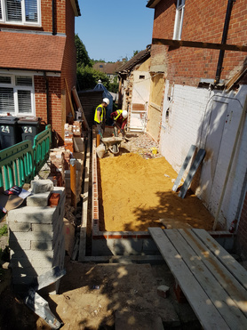 Double storey side extension with pitched roof and raised driveway Project image
