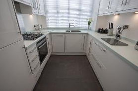 Kitchen Gloss White with Corian Worktop Project image