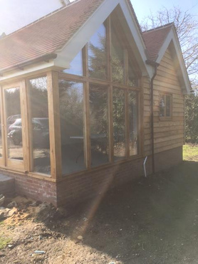 Double Gabled Extension with Solid Oak Work and Larch Cladding Project image