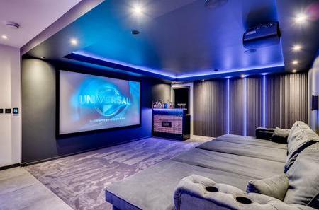 Home cinema in a loft conversion by Rayner Builders & Joiners Ltd