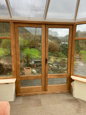 Conservatory replacement roof with new Oak doors and windows. Project image