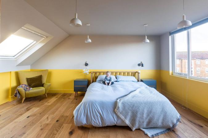 yellow Loft conversion by Pencil and Brick Ltd