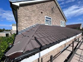 Flat roof converted to pitched tile roof.  Project image