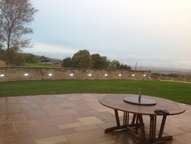  landscaping job grass down and Indian stone flags Project image
