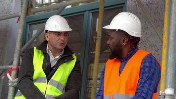 Image of builders talking