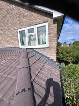 Flat roof converted to pitched tile roof.  Project image