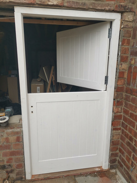 Barn door for garage with acoustic/storm-proof seals to all rebates and door joint Project image