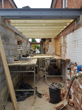 Double storey side extension with pitched roof and raised driveway Project image