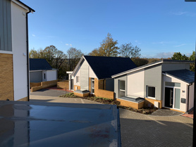 Completed construction of fourteen timber frame houses - Castle Dene Project image