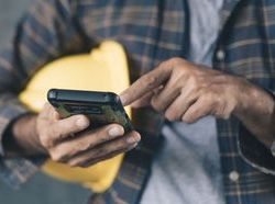 iStock-builder with phone panoramic.jpg