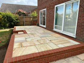 Natural sandstone patio & retaining brickwork platform Project image