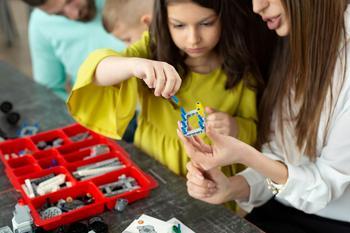 Young girl using construction techniques in STEM learning