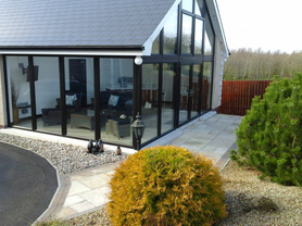 Conservatory with garage for storage at the back Project image