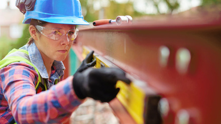 Women in construction builder with spirit level.jpg