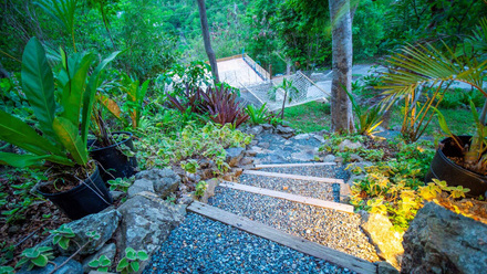 iStock-1414857481 sloping garden evening landscaping steps sleeper.jpg