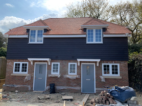 Two new traditionally built semi detached houses, in grounds of former Charity Inn Project image