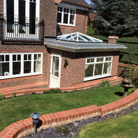 Orangery, Retaining walls, landscaping and bi-fold doors with julliet balcony Project image