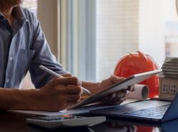 iStock Licence man laptop hard hat.jpg