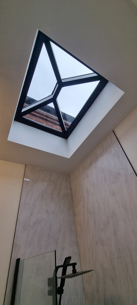 high end bathroom with skylight above the bath   Project image