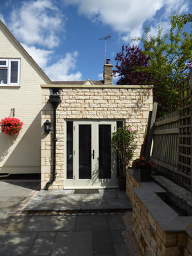 Stone Utility Extension with skylight and hard landscaping project Project image