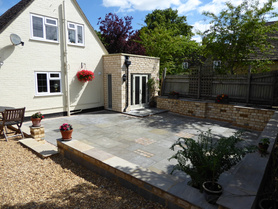 Stone Utility Extension with skylight and hard landscaping project Project image