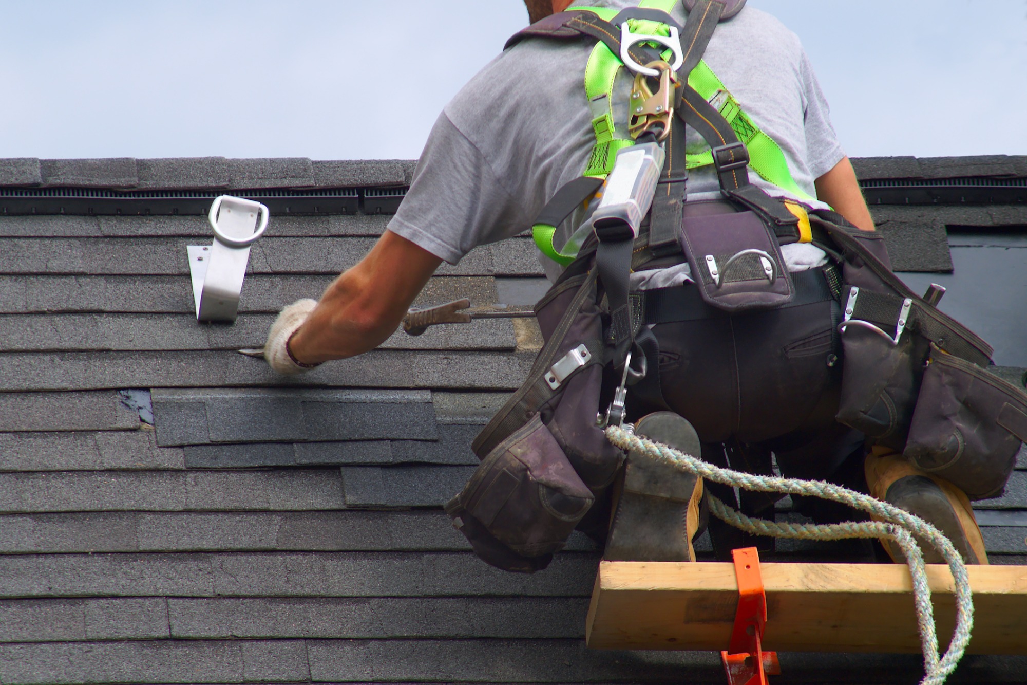 istock roof-repair-construction-worker-roofer-man-roofing-safety.jpg