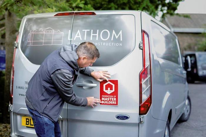 FMB member adding branded sticker to van