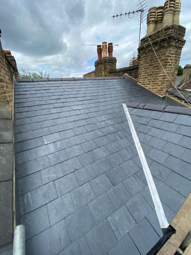 New slate roof and solar installed - London Project image
