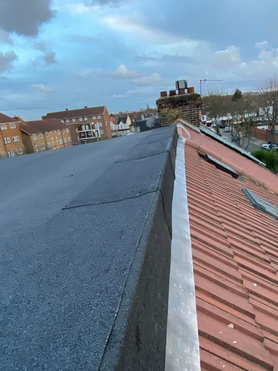 Re pitched a dormer flat roof, has the client had leaks was to flat. Project image