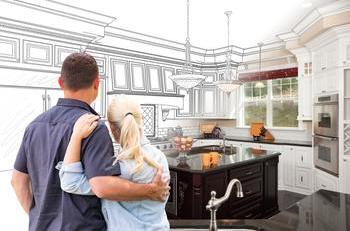 Couple looking at kitchen plans