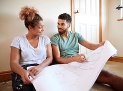 iStock-1083737780 - couple relaxing with plans permitted development rsz.jpg