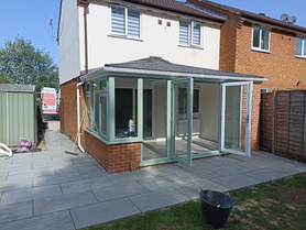 New completed 380 tiled Conservatory with patio works. Project image