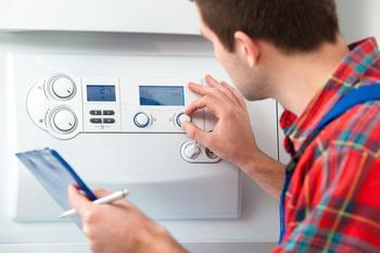 Photo of man fitting a boiler