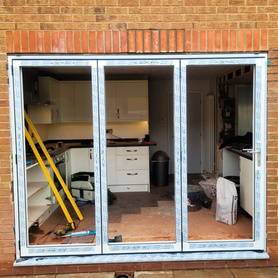 Who doesn't love bi folding doors, the difference they make to a property! Project image