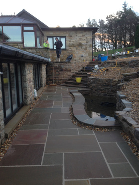 well on the way of a new patio and fish pond Project image